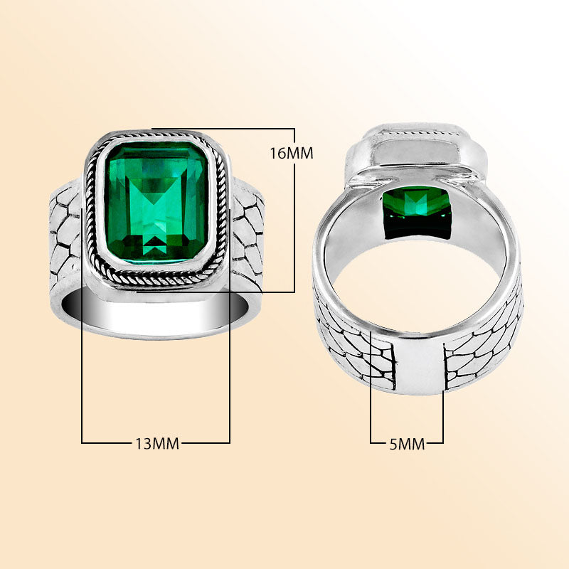 Men’s sterling silver ring with bold emerald-green stone and textured band – stylish statement jewelry gift for him.