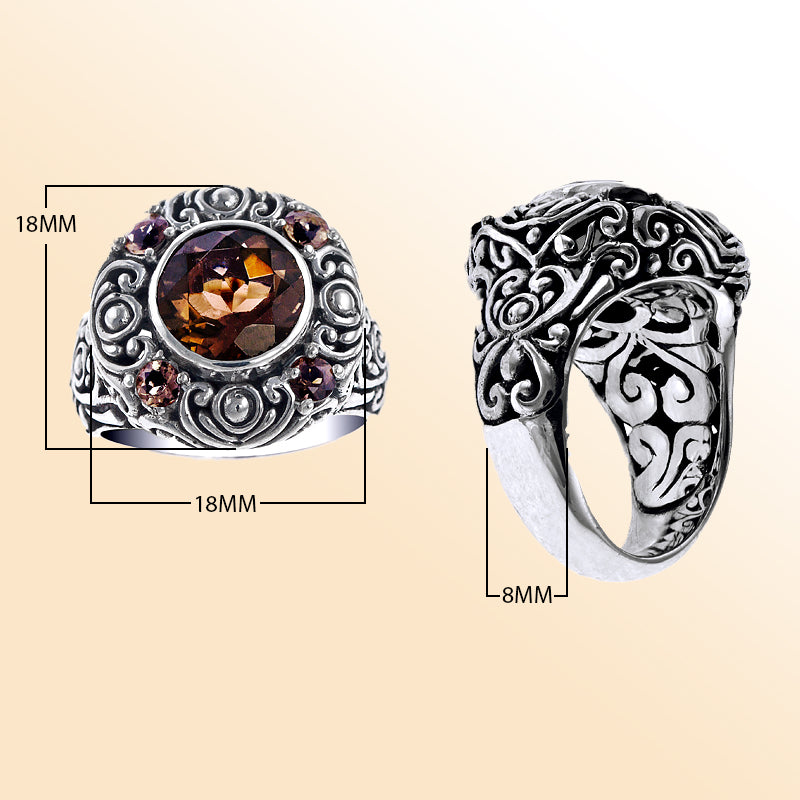 Handcrafted sterling silver ring with smoky quartz center stone and smoky quartz accents, detailed with intricate Balinese carvings.