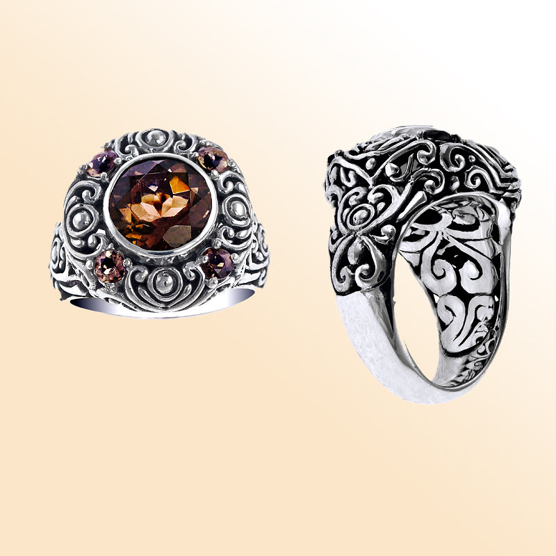 Handcrafted sterling silver ring with smoky quartz center stone and smoky quartz accents, detailed with intricate Balinese carvings.