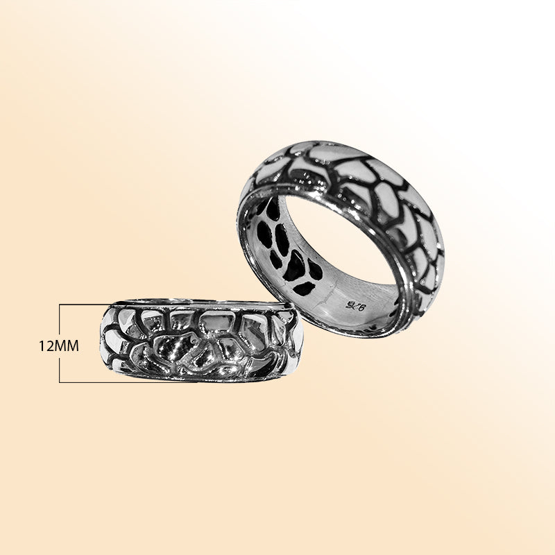 Sterling silver wide band ring with intricate Bali-inspired carved pattern, handcrafted artisan jewelry for everyday wear.