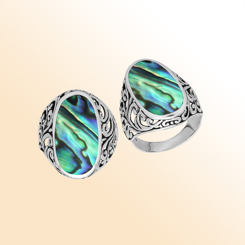 Sterling silver oval Abalone Shell ring with iridescent Shell and intricate Bali filigree design, handcrafted artisan statement jewelry for women.