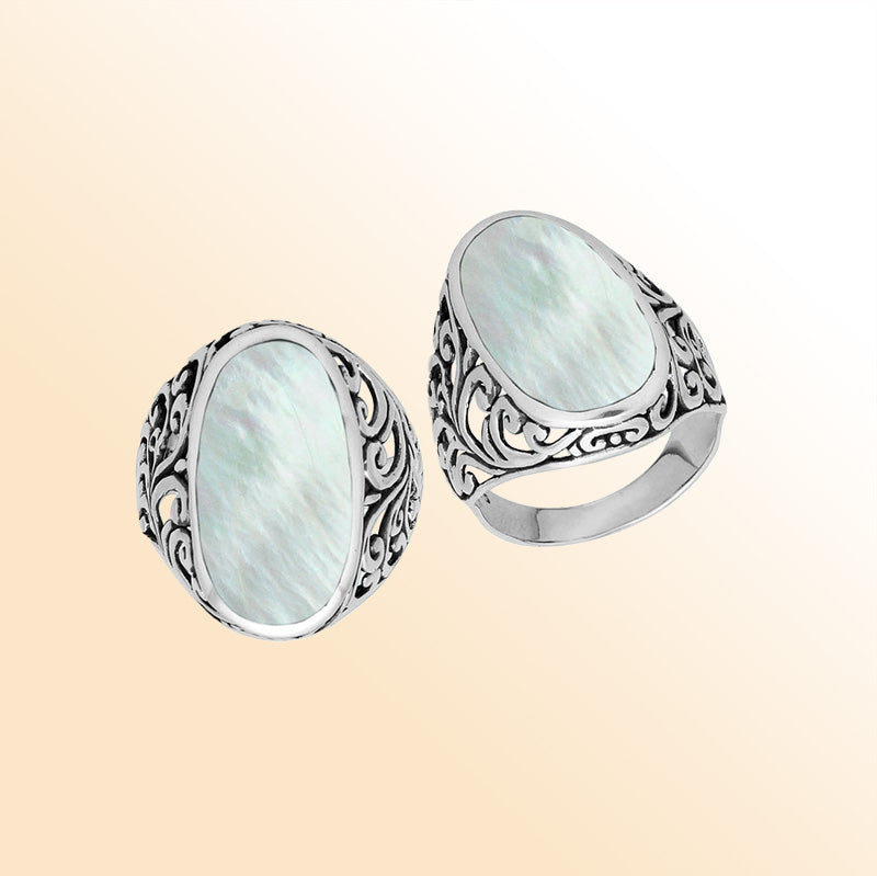 Sterling silver oval Mother of Pearl Shell ring with intricate Bali filigree detailing and oxidized finish, handcrafted artisan statement jewelry for women.