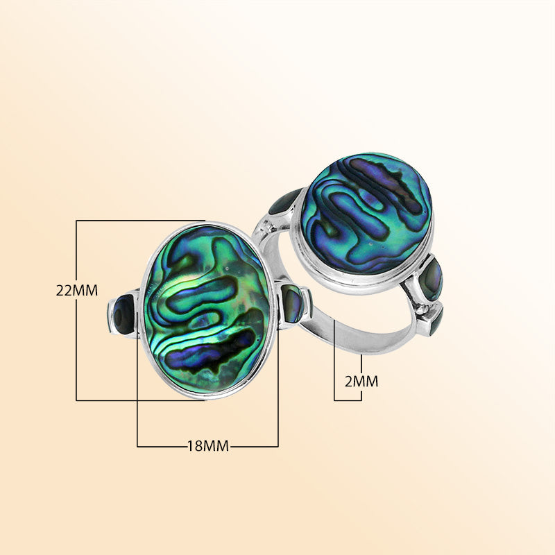 Sterling silver oval Abalone Shell ring with shimmering side inlays, handcrafted artisan jewelry featuring iridescent shell for women.
