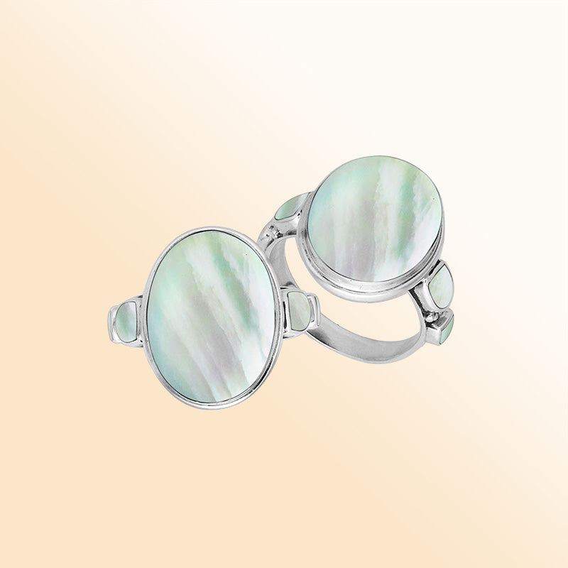 Sterling silver oval Mother of Pearl ring with matching side inlays, handcrafted artisan statement jewelry with elegant iridescent finish.