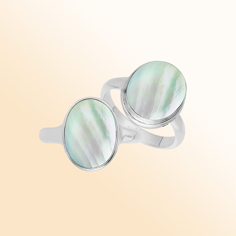 Sterling silver oval Mother of Pearl ring with polished bezel setting, handcrafted artisan statement jewelry with luminous iridescent shell.