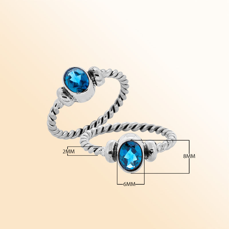 Sterling silver twisted band ring with oval faceted Blue Topaz Quartz, artisan handcrafted jewelry for women, elegant blue Quartz accessory.