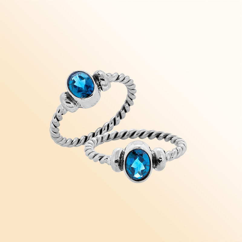 Sterling silver twisted band ring with oval faceted Blue Topaz Quartz, artisan handcrafted jewelry for women, elegant blue Quartz accessory.