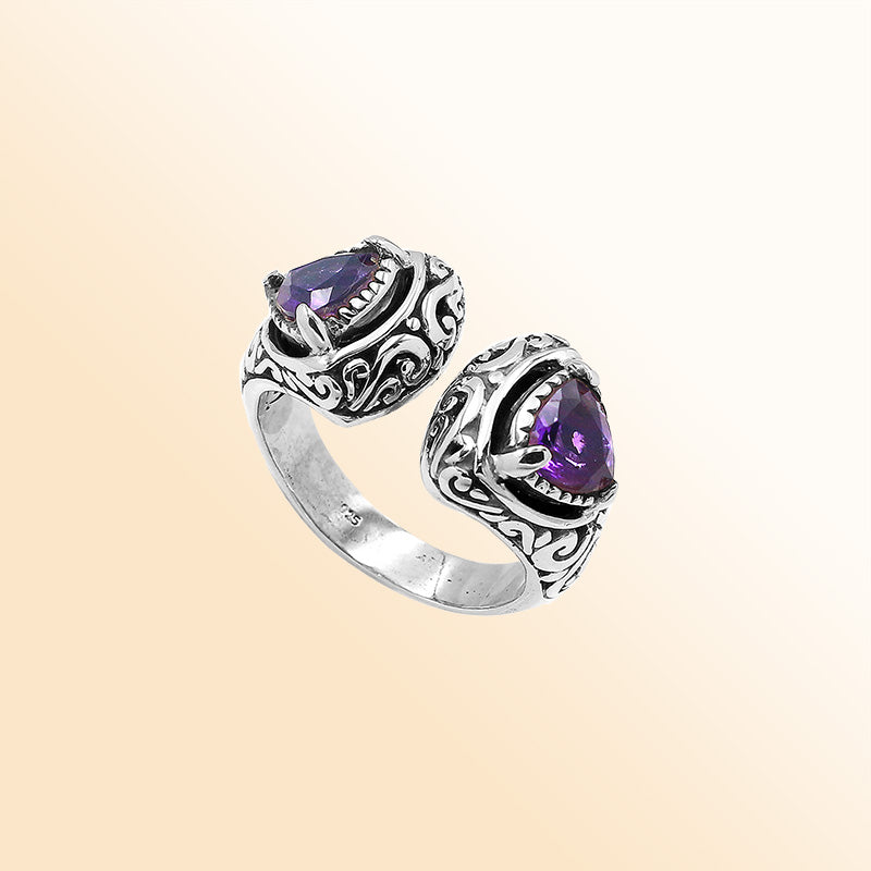 Sterling silver Bali scrollwork ring with trillion-cut purple Amethyst Quartz – artisan handcrafted statement jewelry for women.