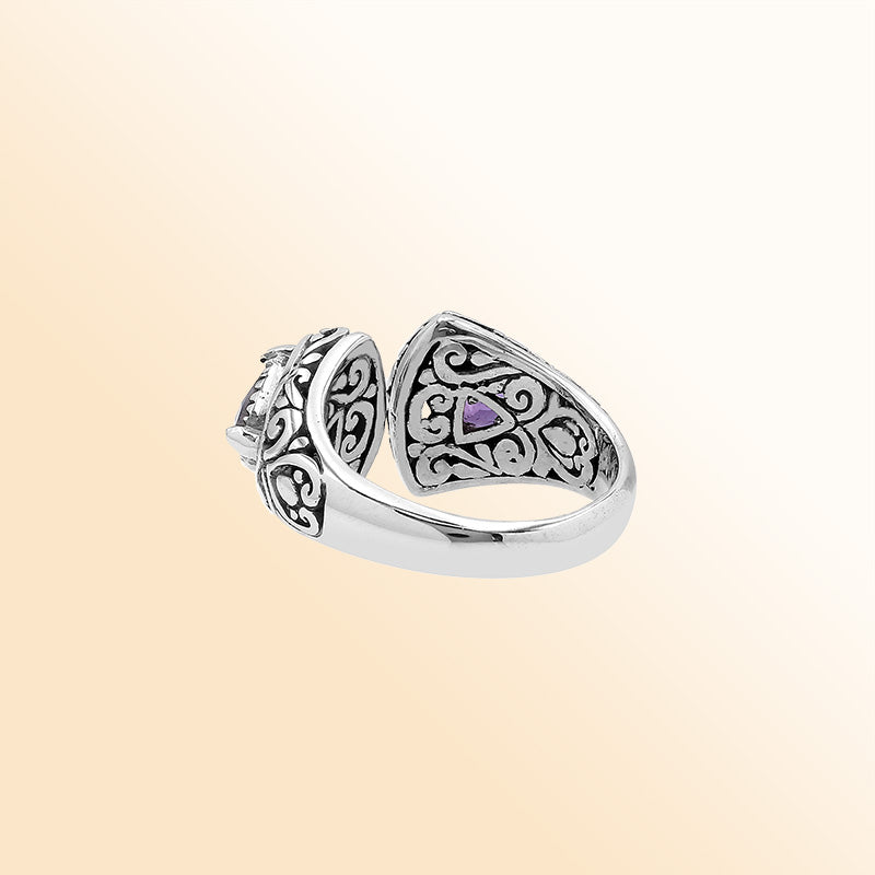 Sterling silver Bali scrollwork ring with trillion-cut purple Amethyst Quartz – artisan handcrafted statement jewelry for women.