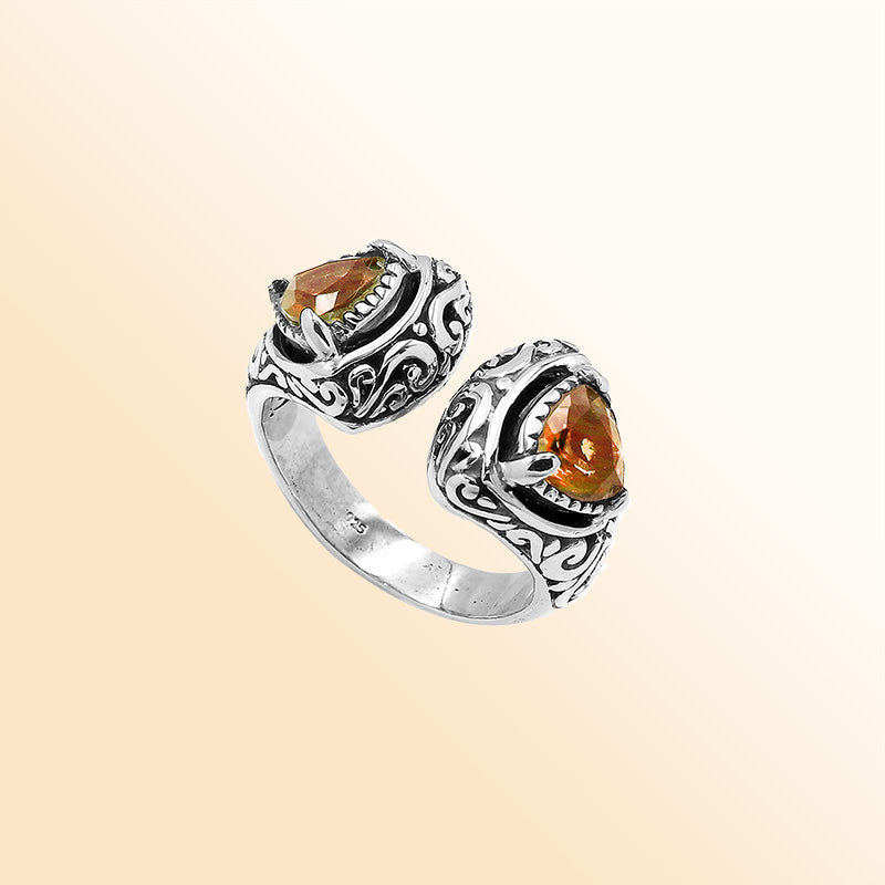 Sterling silver Bali scrollwork ring with trillion-cut golden Citrine Quartz– artisan handcrafted statement jewelry for women. 