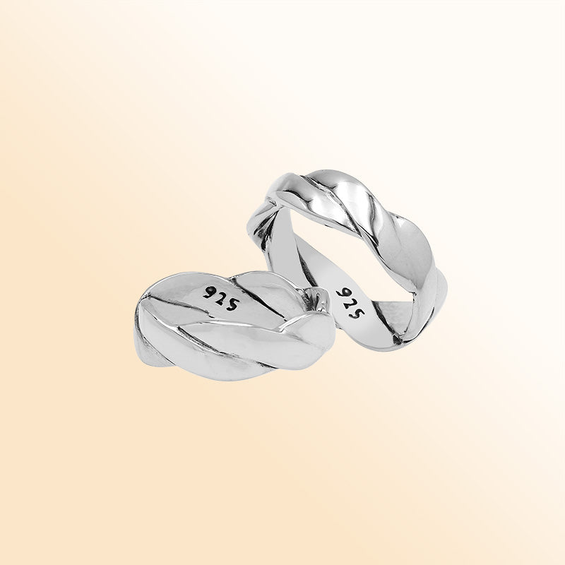 Sterling silver twisted braid band ring with polished finish – unisex artisan jewelry for everyday wear or stacking.