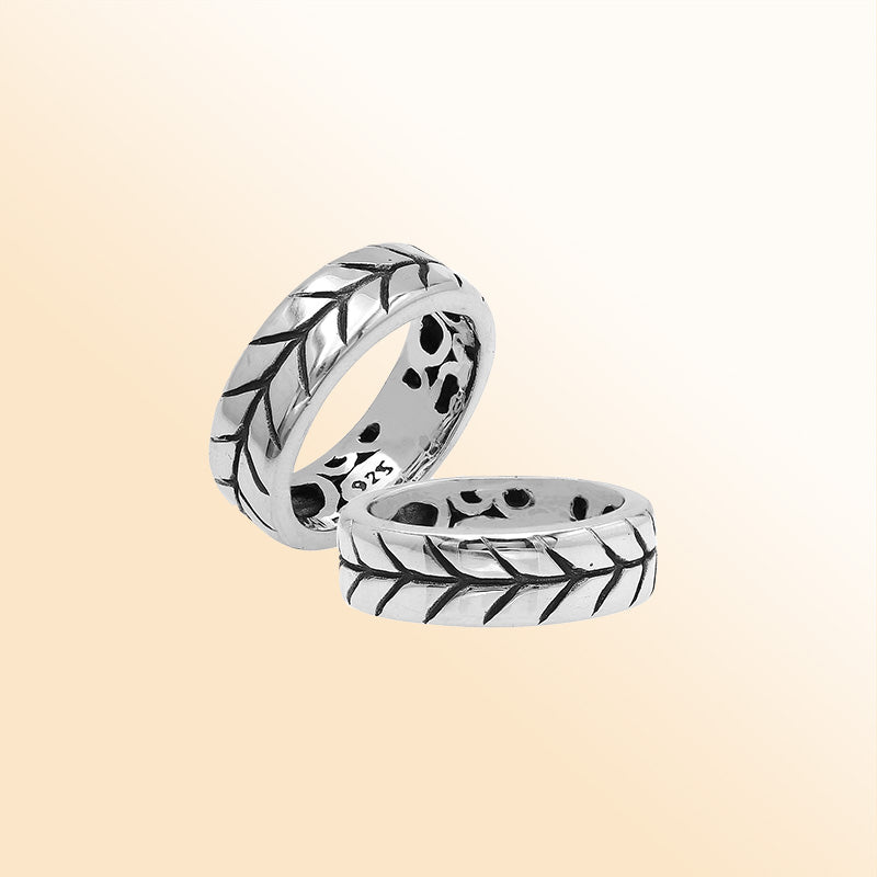 Handcrafted sterling silver band ring with detailed leaf pattern and oxidized finish, unisex artisan jewelry for everyday wear or gifting.