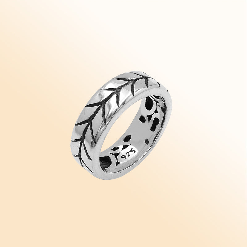 Handcrafted sterling silver band ring with detailed leaf pattern and oxidized finish, unisex artisan jewelry for everyday wear or gifting.