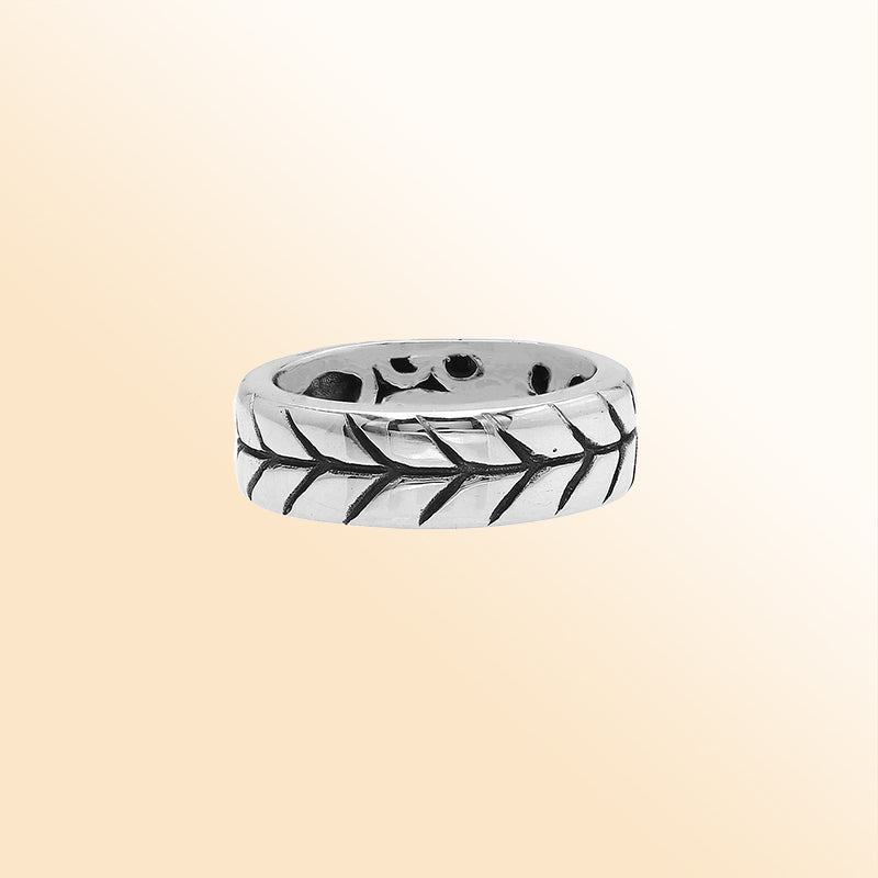Handcrafted sterling silver band ring with detailed leaf pattern and oxidized finish, unisex artisan jewelry for everyday wear or gifting.