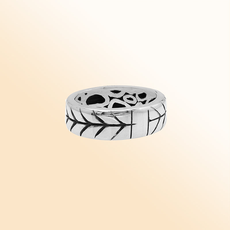 Handcrafted sterling silver band ring with detailed leaf pattern and oxidized finish, unisex artisan jewelry for everyday wear or gifting.