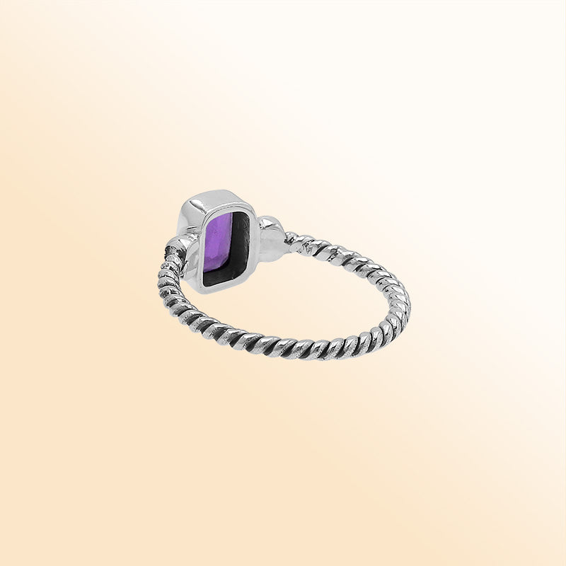 Handcrafted sterling silver twisted band ring with rectangular-cut Amethyst Quartz, artisan unisex jewelry for everyday wear or gifting.