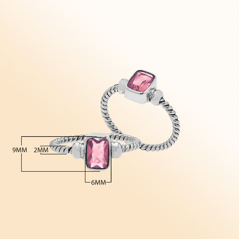 Handcrafted sterling silver twisted band ring with rectangular-cut Pink Quartz, artisan unisex jewelry for everyday wear or gifting.