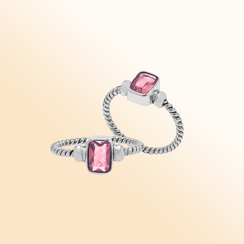 Handcrafted sterling silver twisted band ring with rectangular-cut Pink Quartz, artisan unisex jewelry for everyday wear or gifting.