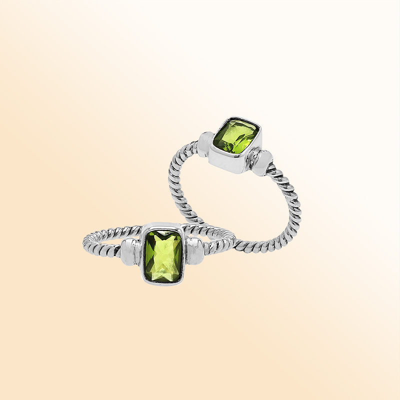 Handcrafted sterling silver twisted band ring with rectangular-cut Peridot Quartz, artisan unisex jewelry for everyday wear or gifting.