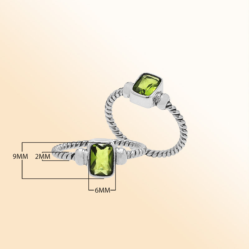 Handcrafted sterling silver twisted band ring with rectangular-cut Peridot Quartz, artisan unisex jewelry for everyday wear or gifting.