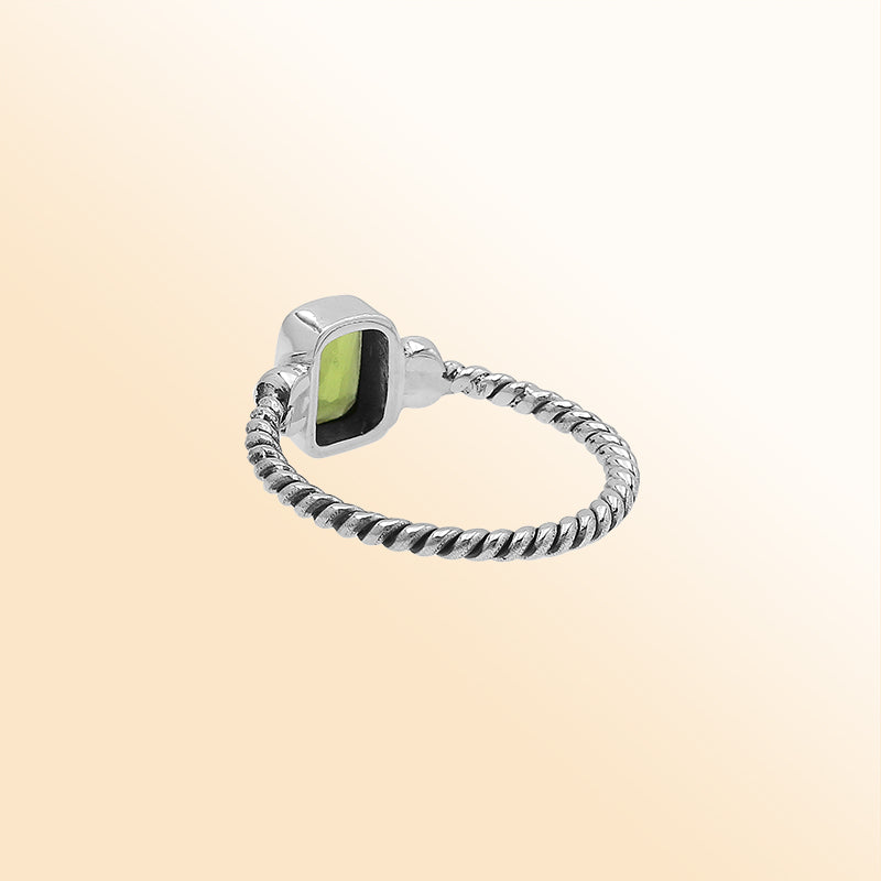 Handcrafted sterling silver twisted band ring with rectangular-cut Peridot Quartz, artisan unisex jewelry for everyday wear or gifting.