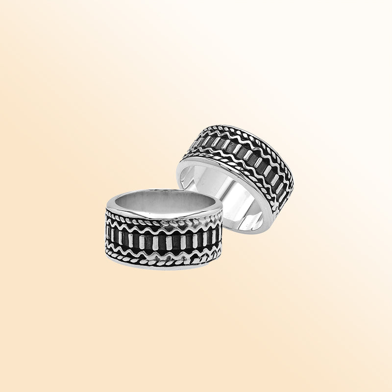 Handcrafted sterling silver wide band ring with oxidized Bali-inspired carvings, unisex artisan jewelry for everyday wear or gifting.