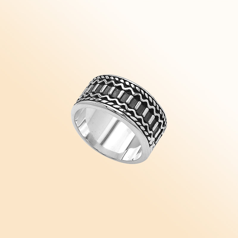 Handcrafted sterling silver wide band ring with oxidized Bali-inspired carvings, unisex artisan jewelry for everyday wear or gifting.