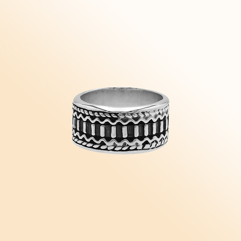Handcrafted sterling silver wide band ring with oxidized Bali-inspired carvings, unisex artisan jewelry for everyday wear or gifting.