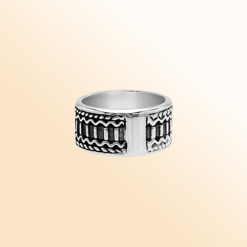 Handcrafted sterling silver wide band ring with oxidized Bali-inspired carvings, unisex artisan jewelry for everyday wear or gifting.