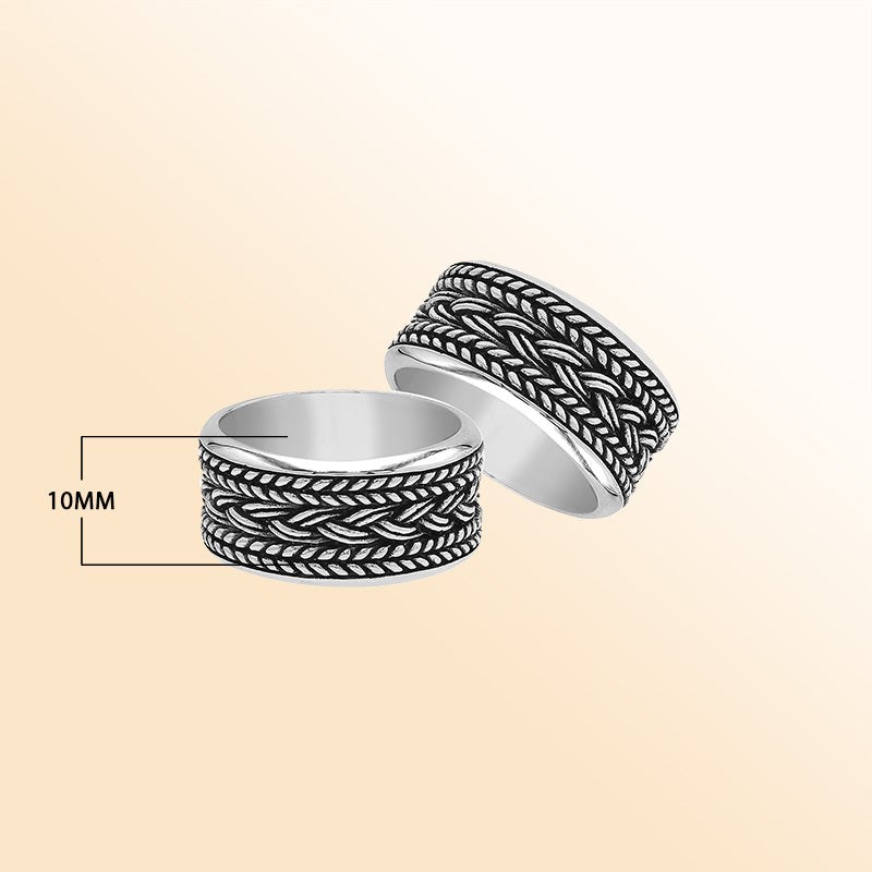 Handcrafted sterling silver wide band ring with intricate braided Bali-inspired design and oxidized finish, unisex artisan jewelry for everyday wear or gifting.
