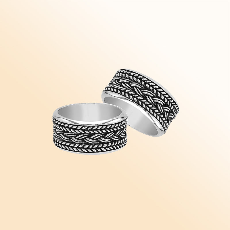 Handcrafted sterling silver wide band ring with intricate braided Bali-inspired design and oxidized finish, unisex artisan jewelry for everyday wear or gifting.