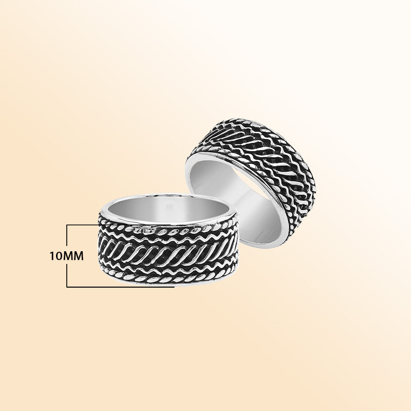Handcrafted sterling silver wide band ring with diagonal braided Bali-inspired design and oxidized finish, unisex artisan jewelry for everyday wear or gifting.