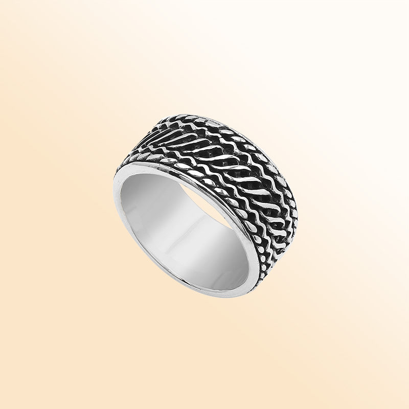 Handcrafted sterling silver wide band ring with diagonal braided Bali-inspired design and oxidized finish, unisex artisan jewelry for everyday wear or gifting.
