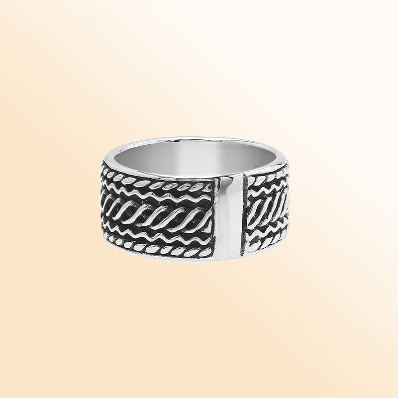 Handcrafted sterling silver wide band ring with diagonal braided Bali-inspired design and oxidized finish, unisex artisan jewelry for everyday wear or gifting.