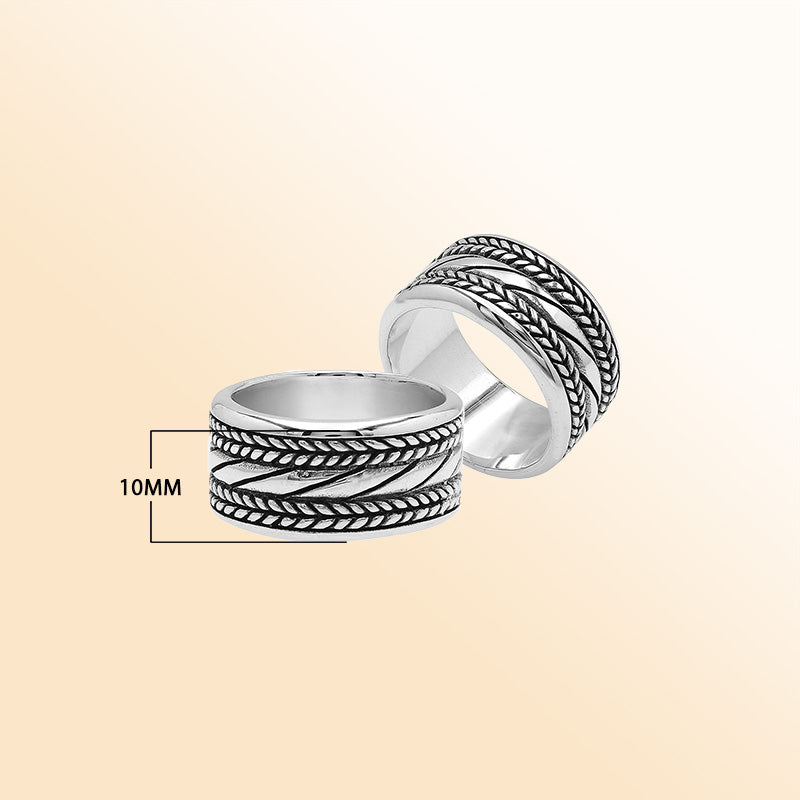 Handcrafted sterling silver wide band ring with diagonal rope Bali-inspired design and oxidized finish, unisex artisan jewelry for everyday wear or gifting.