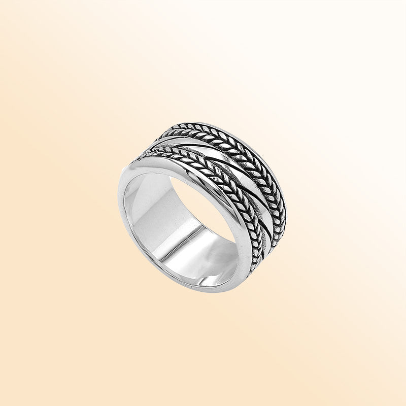 Handcrafted sterling silver wide band ring with diagonal rope Bali-inspired design and oxidized finish, unisex artisan jewelry for everyday wear or gifting.