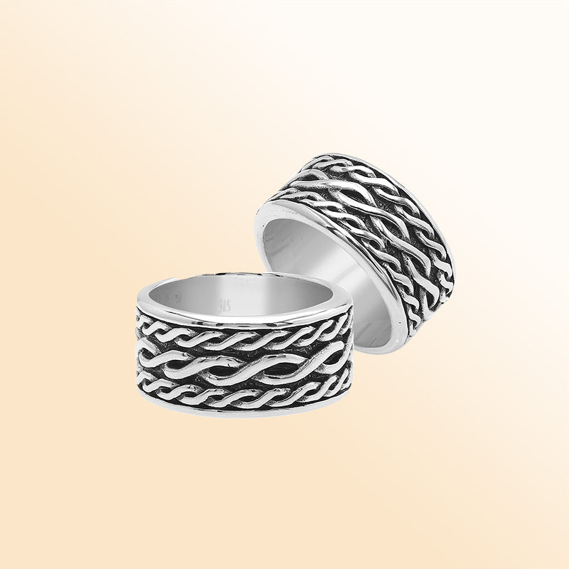Handcrafted sterling silver wide band ring with wavy braid Bali-inspired design and oxidized finish, unisex artisan jewelry for everyday wear or gifting.
