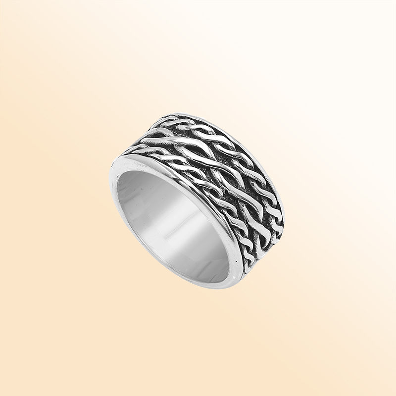 Handcrafted sterling silver wide band ring with wavy braid Bali-inspired design and oxidized finish, unisex artisan jewelry for everyday wear or gifting.