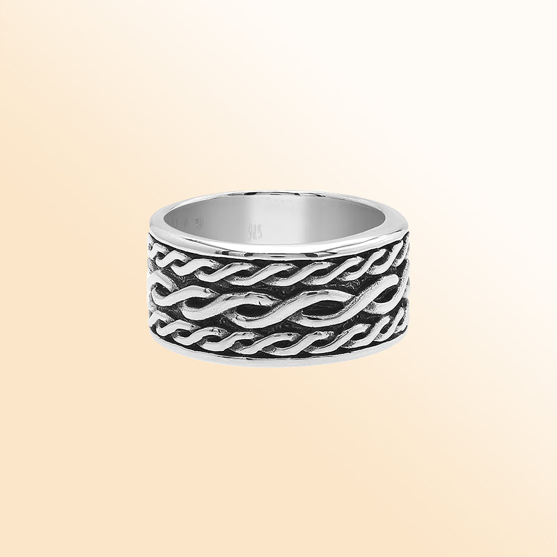 Handcrafted sterling silver wide band ring with wavy braid Bali-inspired design and oxidized finish, unisex artisan jewelry for everyday wear or gifting.