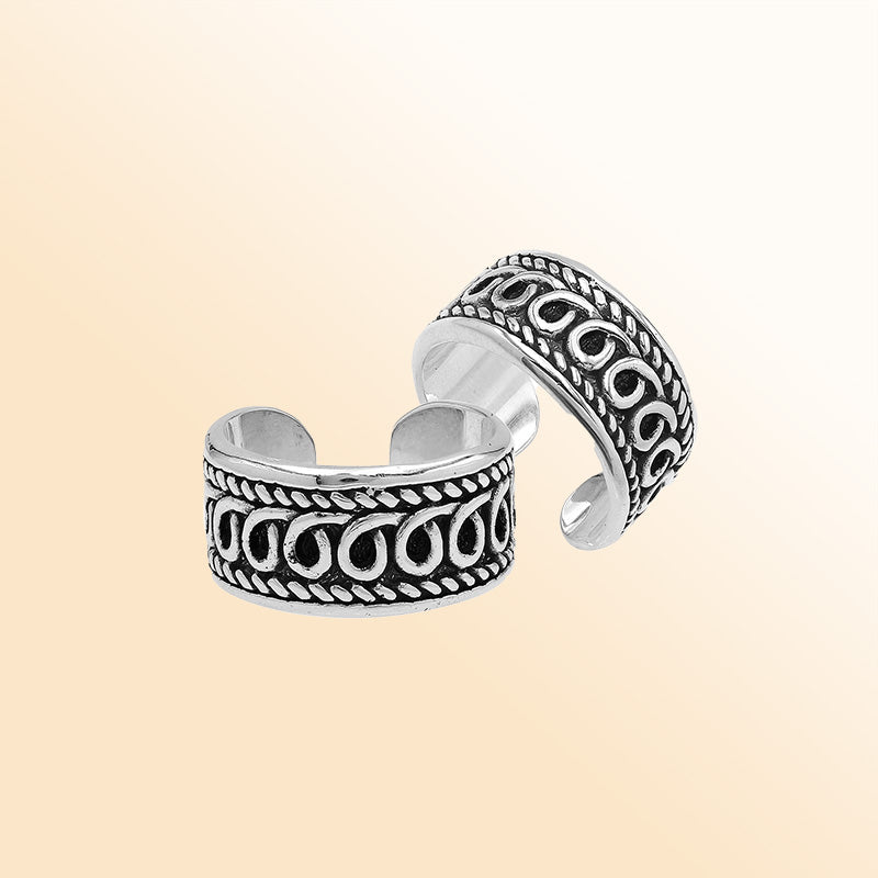 Handcrafted sterling silver open-band ring with intricate Bali swirl design and oxidized finish, adjustable unisex artisan jewelry for everyday wear or gifting.