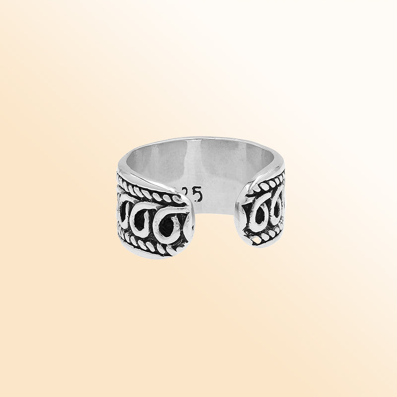 Handcrafted sterling silver open-band ring with intricate Bali swirl design and oxidized finish, adjustable unisex artisan jewelry for everyday wear or gifting.