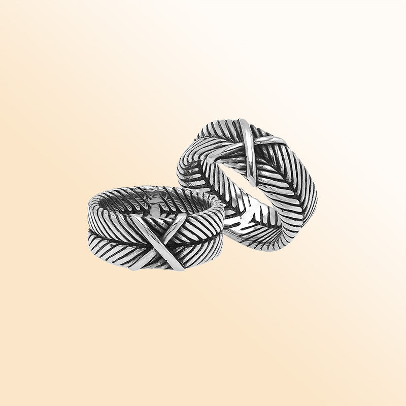 Handcrafted sterling silver band ring with X-pattern and leaf design, Bali-inspired oxidized artisan jewelry for men and women.