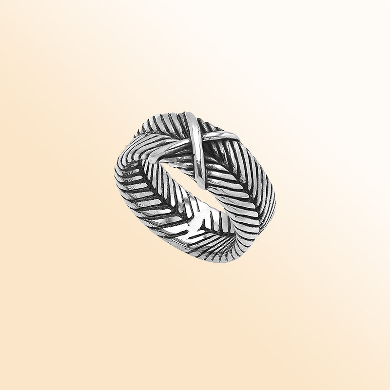 Handcrafted sterling silver band ring with X-pattern and leaf design, Bali-inspired oxidized artisan jewelry for men and women.