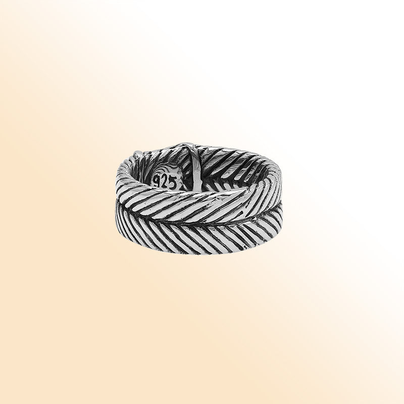 Handcrafted sterling silver band ring with X-pattern and leaf design, Bali-inspired oxidized artisan jewelry for men and women.