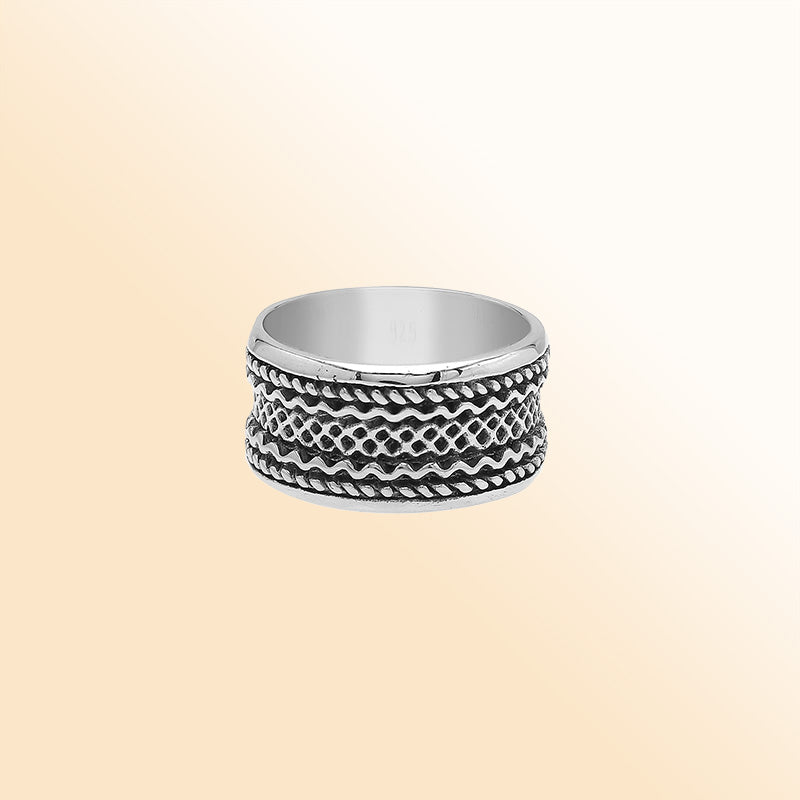 Sterling silver wide band ring with handcrafted tribal Bali design and oxidized detailing, perfect for everyday wear or special occasions.