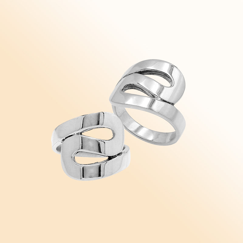 Sterling silver openwork statement ring with adjustable band, modern polished silver jewelry for everyday wear and special occasions.