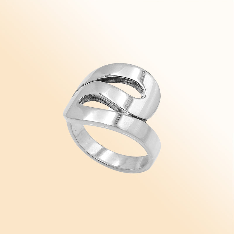 Sterling silver openwork statement ring with adjustable band, modern polished silver jewelry for everyday wear and special occasions.