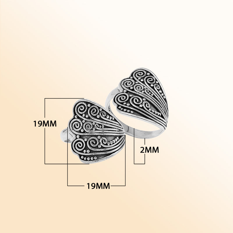 Sterling silver adjustable ring with elegant Balinese swirl and dot design, handcrafted artisan jewelry for everyday style.