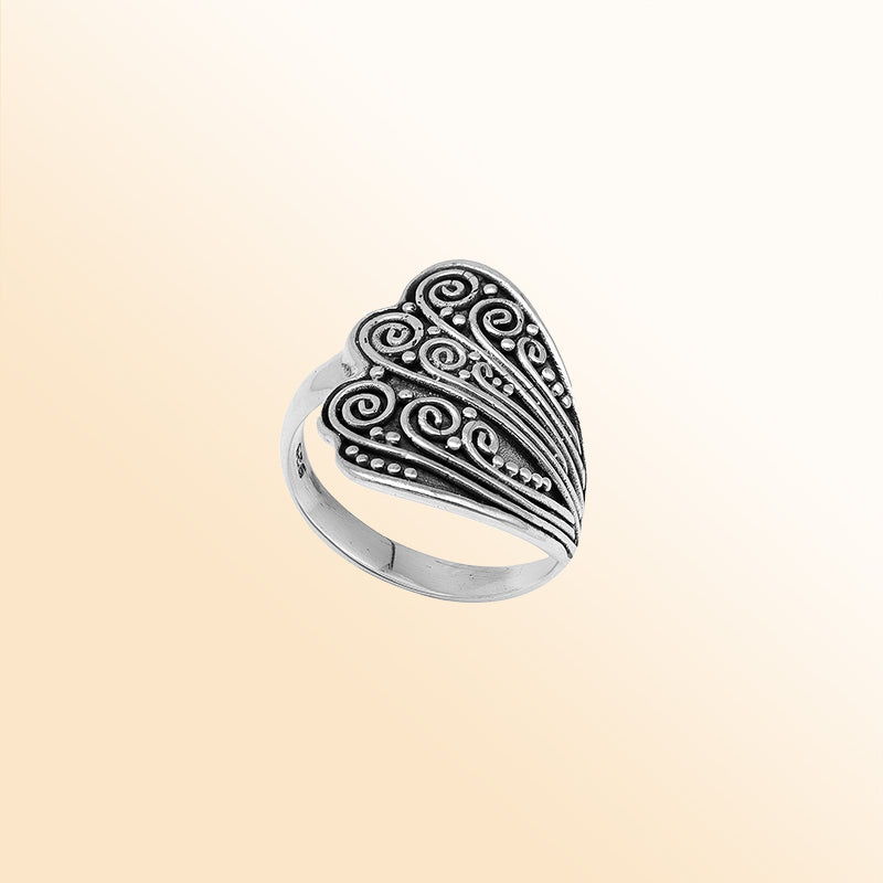 Sterling silver adjustable ring with elegant Balinese swirl and dot design, handcrafted artisan jewelry for everyday style.
