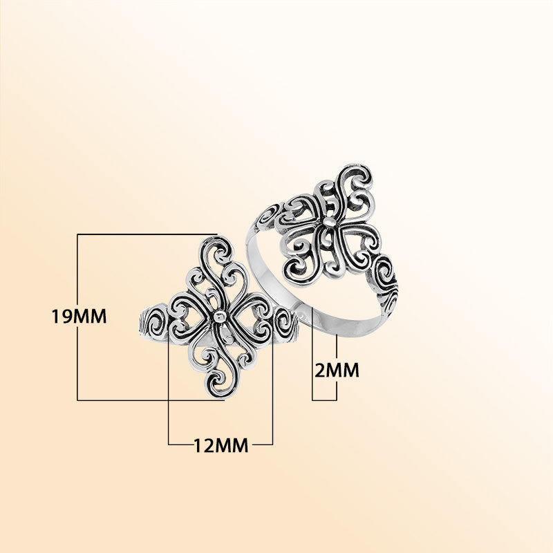 Sterling silver adjustable ring with elegant floral swirl design, handcrafted Balinese artisan jewelry for everyday wear.